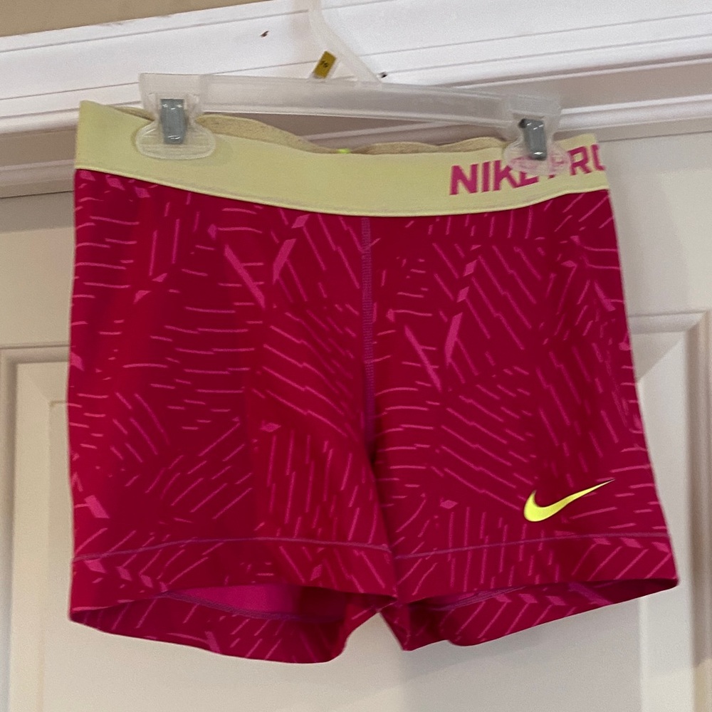 Nike Women's Pink Athletic Shorts with Yellow Waistband